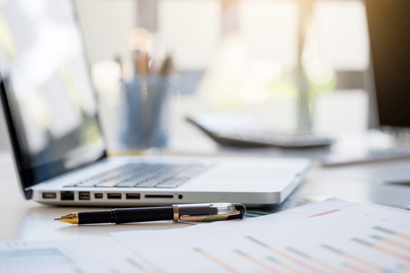 laptap on desktop to depitct the Source Business Finance with Confidence